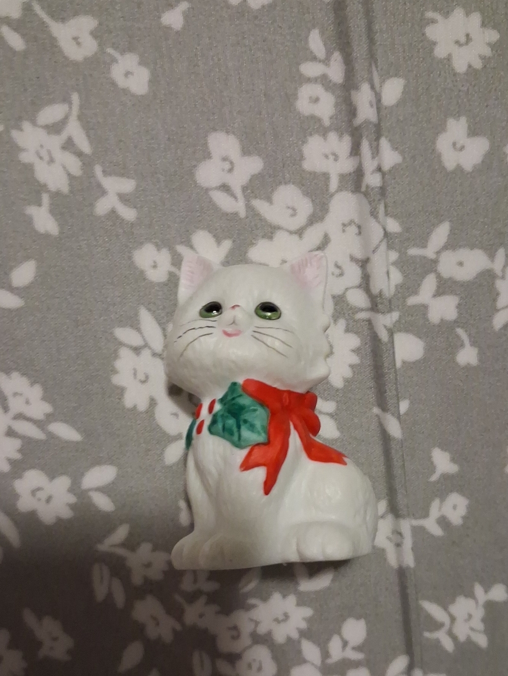 White Ceramic Cat Figurine with Red Bow and Green Holly Accent